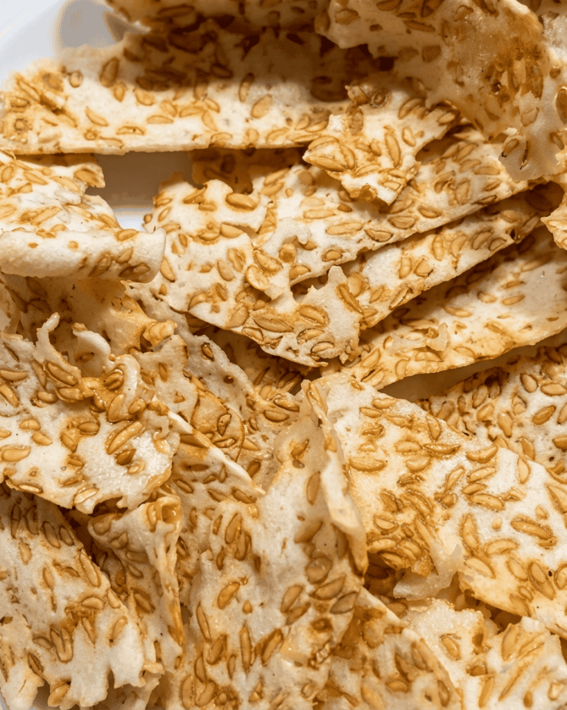 SoyaMaya tempeh protein chips with toasted sesame seeds, crispy texture, and healthy plant-based sn.