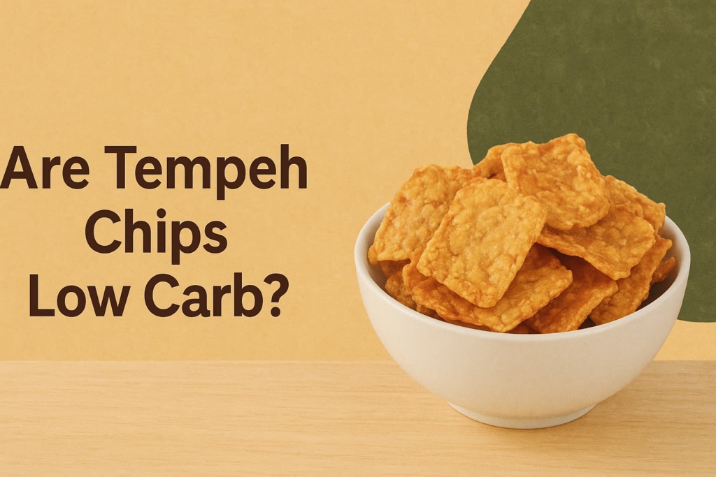 “Tempeh chips in a white bowl, with the question "Are Tempeh Chips Low Carb?" overlaid on the image, highlighting the nutritional benefits of this snack”.