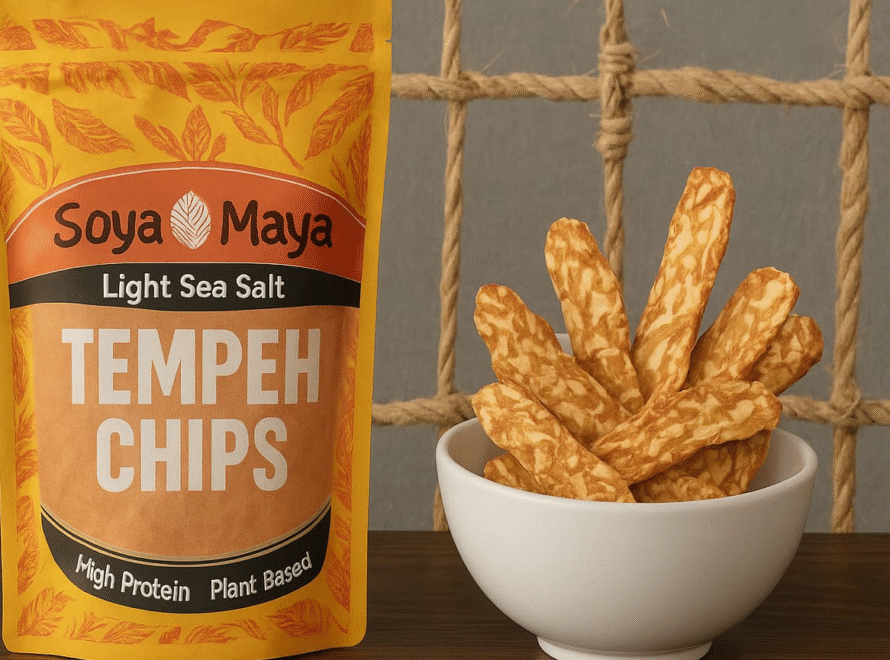 “Soya Maya's plant-based tempeh chips made with light sea salt, displayed in a package and a ceramic bowl”.