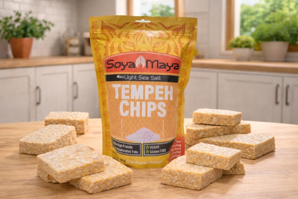 Tempeh chips package with stacked tempeh blocks on a kitchen counter, showing what happens if tempeh is left out.