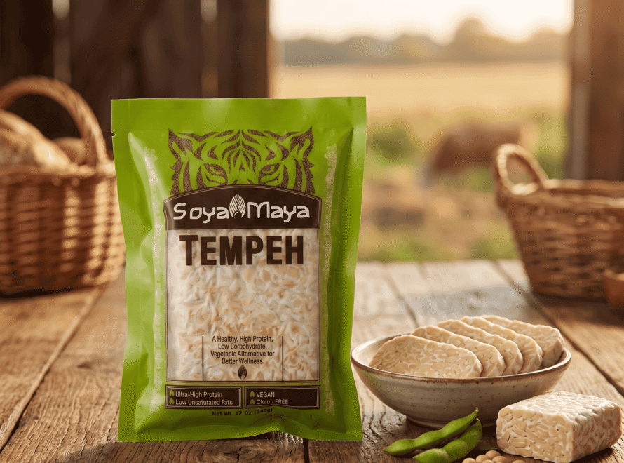 Pack of Soya Maya Tempeh with fresh slices on a wooden table.